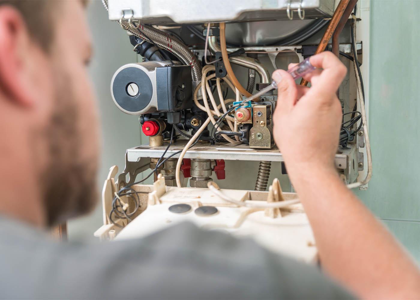 Gas Safe heating engineer servicing a boiler in a North London home